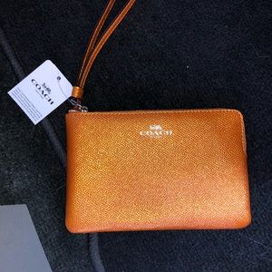 Burnt orange coach wristlet